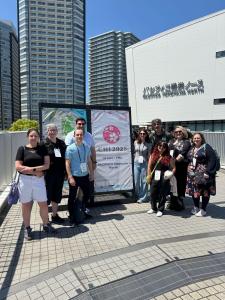 RAi UK researchers smiling in front of Welcome to CHI 2025 sign