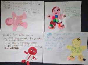 Four sheets of paper with 'AI dolls' and text